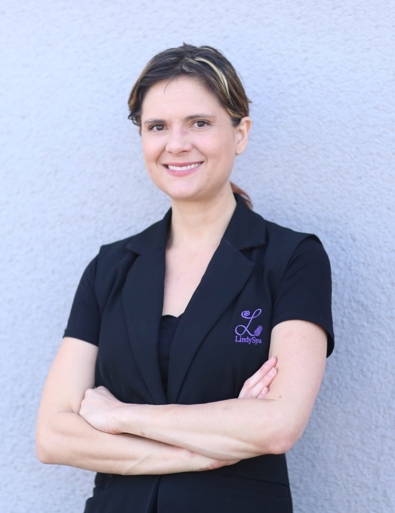 A photo of Lindy Crandall - Certified Massage Therapist (CMT), Licenced Cosmetologist (LPC), and business owner of LindySpa Massage and Skincare - personalized & signature spa services.